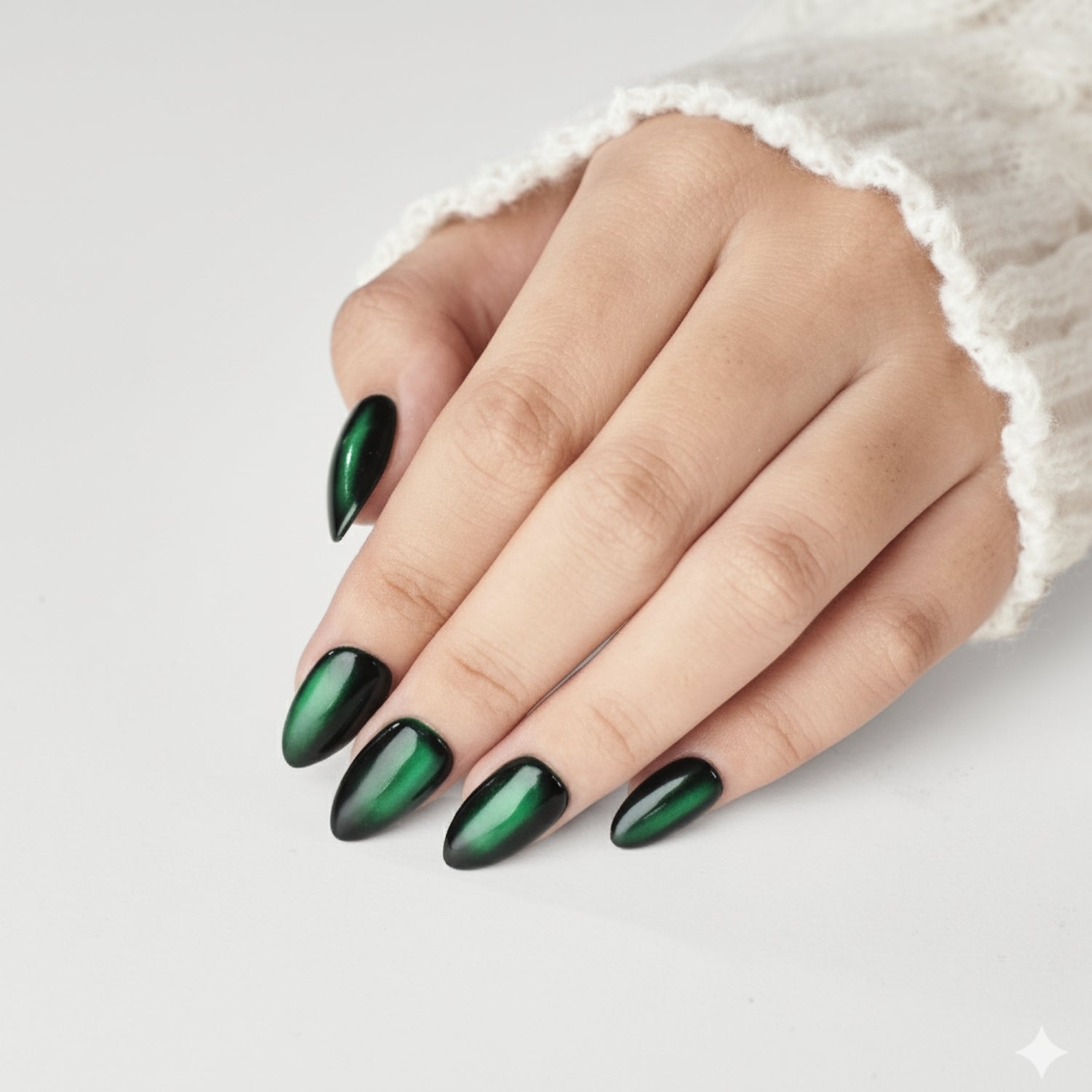 Short almond-shaped dark green press-on nails by Nailique, reusable gel tips with glue and remover, salon-quality manicure for women.