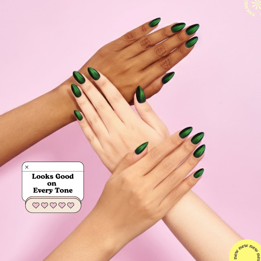 Handmade short almond press on nails by Nailique in dark green emerald eclipse with soft gel finish, 26 reusable tips with glue and remover