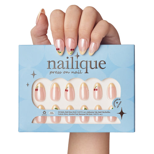 Short almond press on nails by nailique with handmade butter yellow French tips and cherry glazed chrome finish.