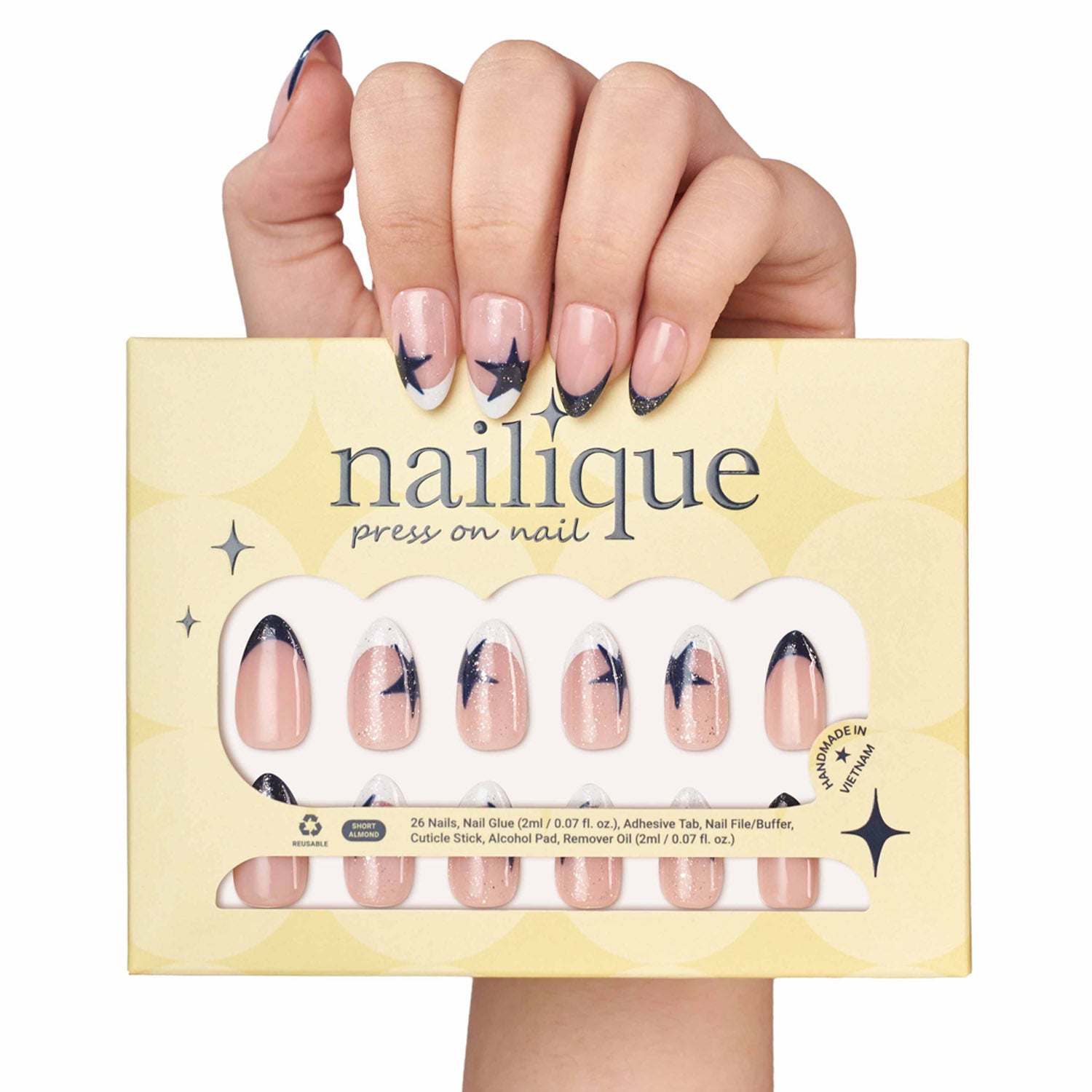 Handmade navy blue short almond press on nails with French tip, star glitter shimmer, soft gel finish by Nailique