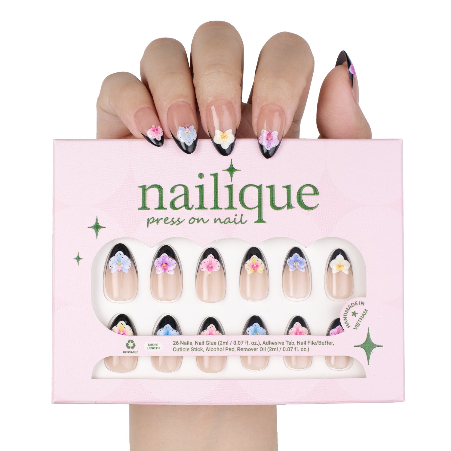 Short almond press-on nails by Nailique featuring black French tips, 3D orchid flower art, reusable gel nails, with glue and remover