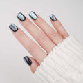 Short square press-on nails by Nailique featuring blue cat eye design, silver stars, reusable tips, and lamp-curable glue for salon-quality manicure