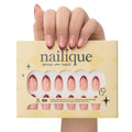 Short almond press-on nails by nailique with red French tips, cat eye soft gel finish, and yellow shimmer accents.
