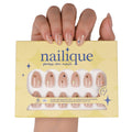 Nailique short almond press on nails with nude pink gel finish, gold star accents, reusable tips, and included nail glue and remover.
