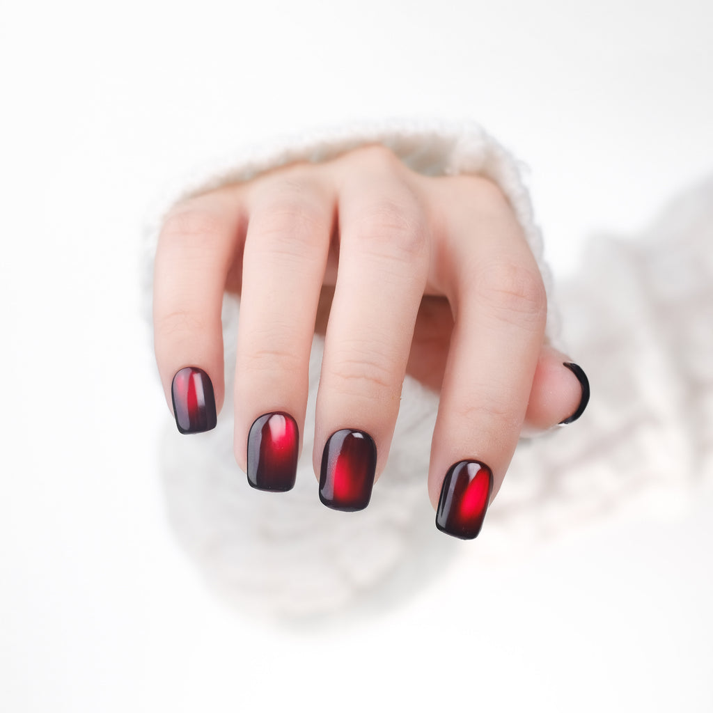 Handmade burgundy red short square press-on nails by Nailique, with cat eye effect, reusable tips, lamp-curable glue, perfect for romantic manicure