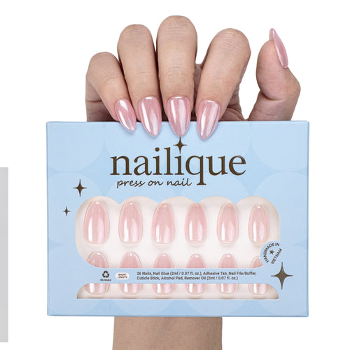 Handmade short almond press on nails in baby pink chrome with glitter shimmer, reusable gel tips, and lamp-curable glue by Nailique.