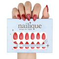 Nailique short almond press-on nails with glossy red finish, metallic stud accents, polka dot design, 26 reusable gel nail tips.