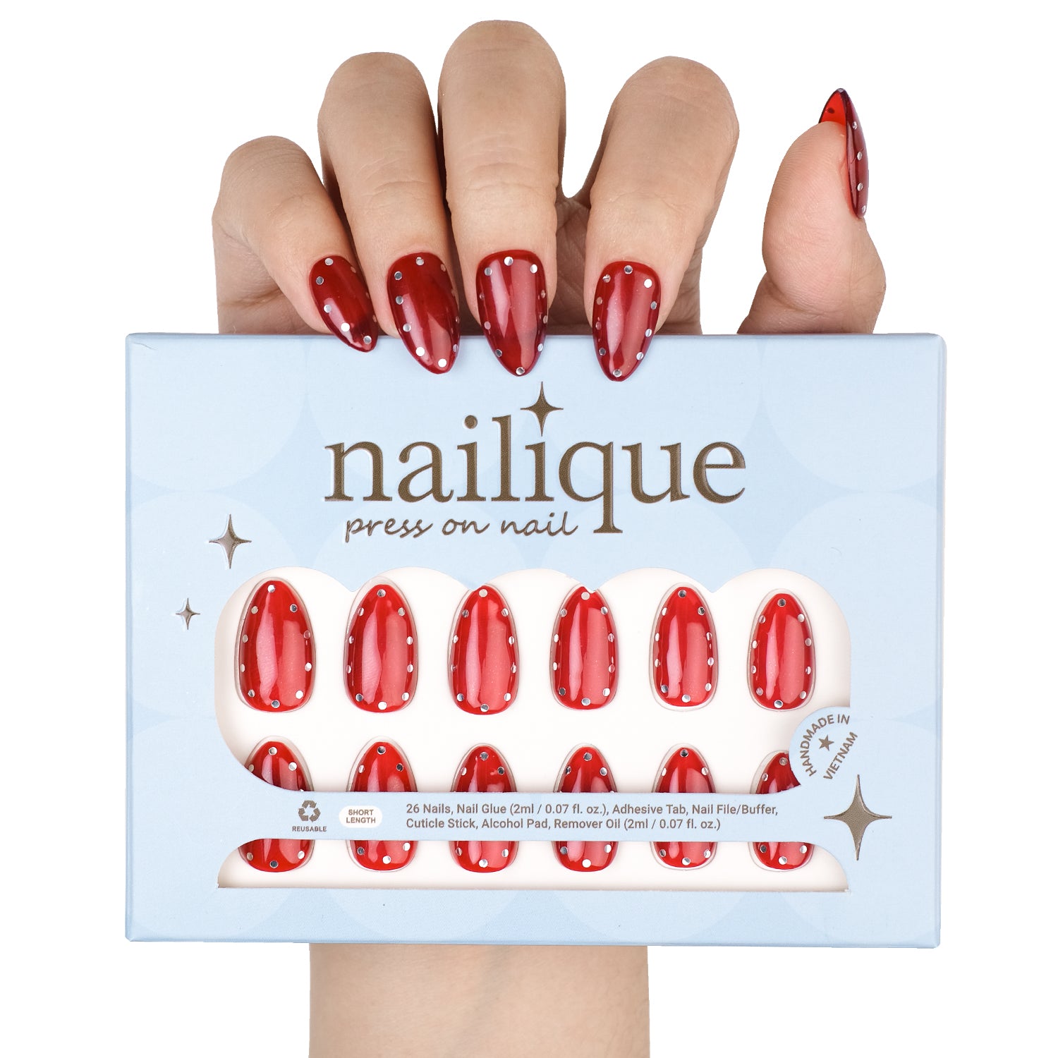 Nailique short almond press-on nails with glossy red finish, metallic stud accents, polka dot design, 26 reusable gel nail tips.