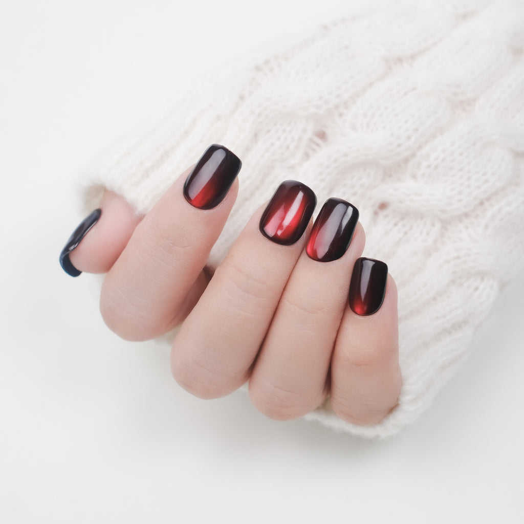 Handmade burgundy red cat eye press on nails with soft gel, 26 reusable short square nail tips, with lamp-curable glue for salon-quality manicure.