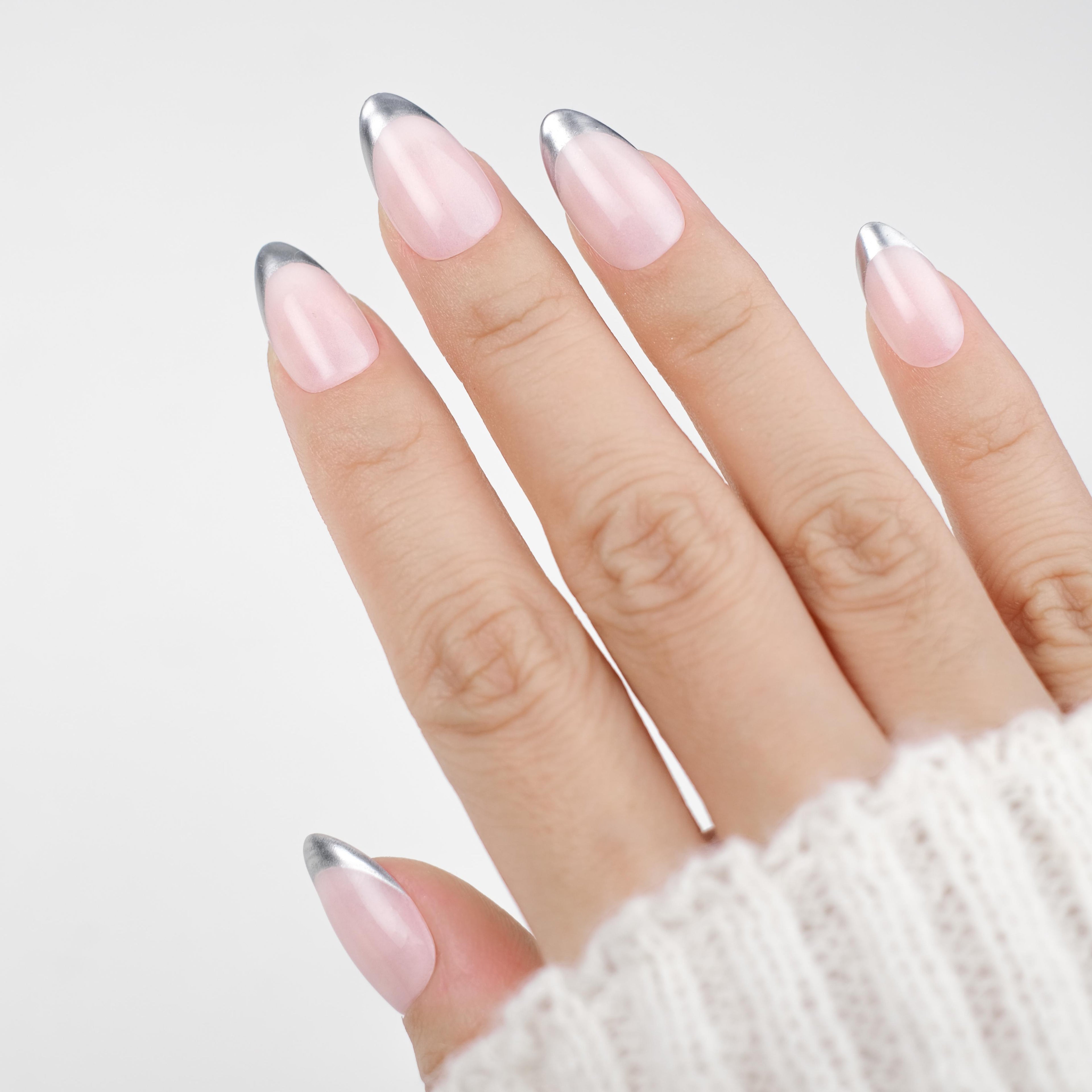 Nailique short almond press-on nails with nude chrome finish, silver metallic edge, handmade soft gel, minimalist reusable 26-piece set.