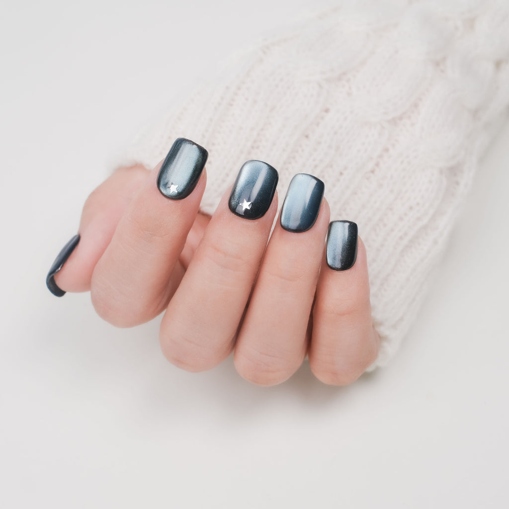 Handmade blue cat eye short square press-on nails with silver star design, reusable gel tips and lamp-curable glue for bridal and party.