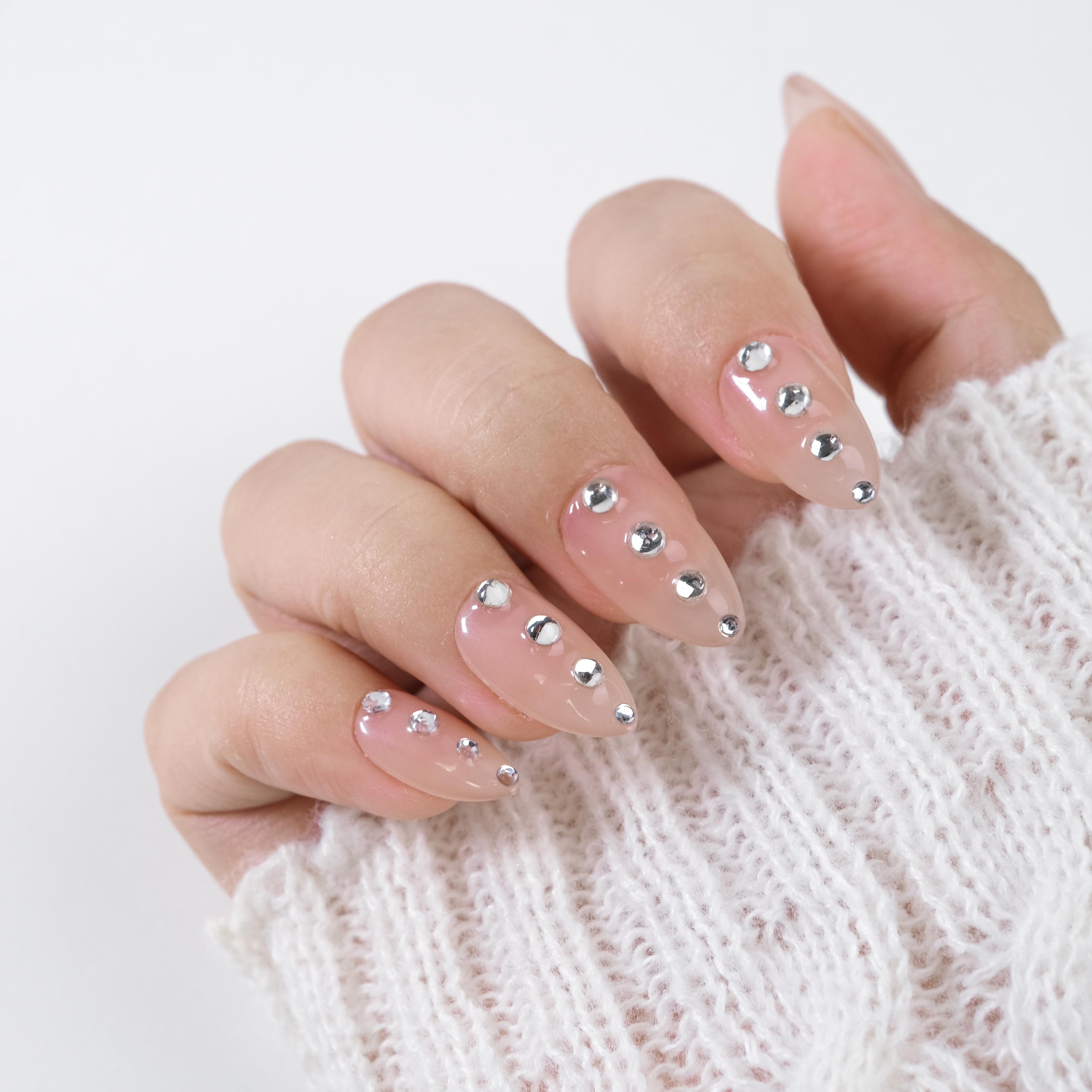 Nude almond press-on nails with silver crystal rhinestone accents, handmade soft gel manicure set, reusable 26pcs by nailique