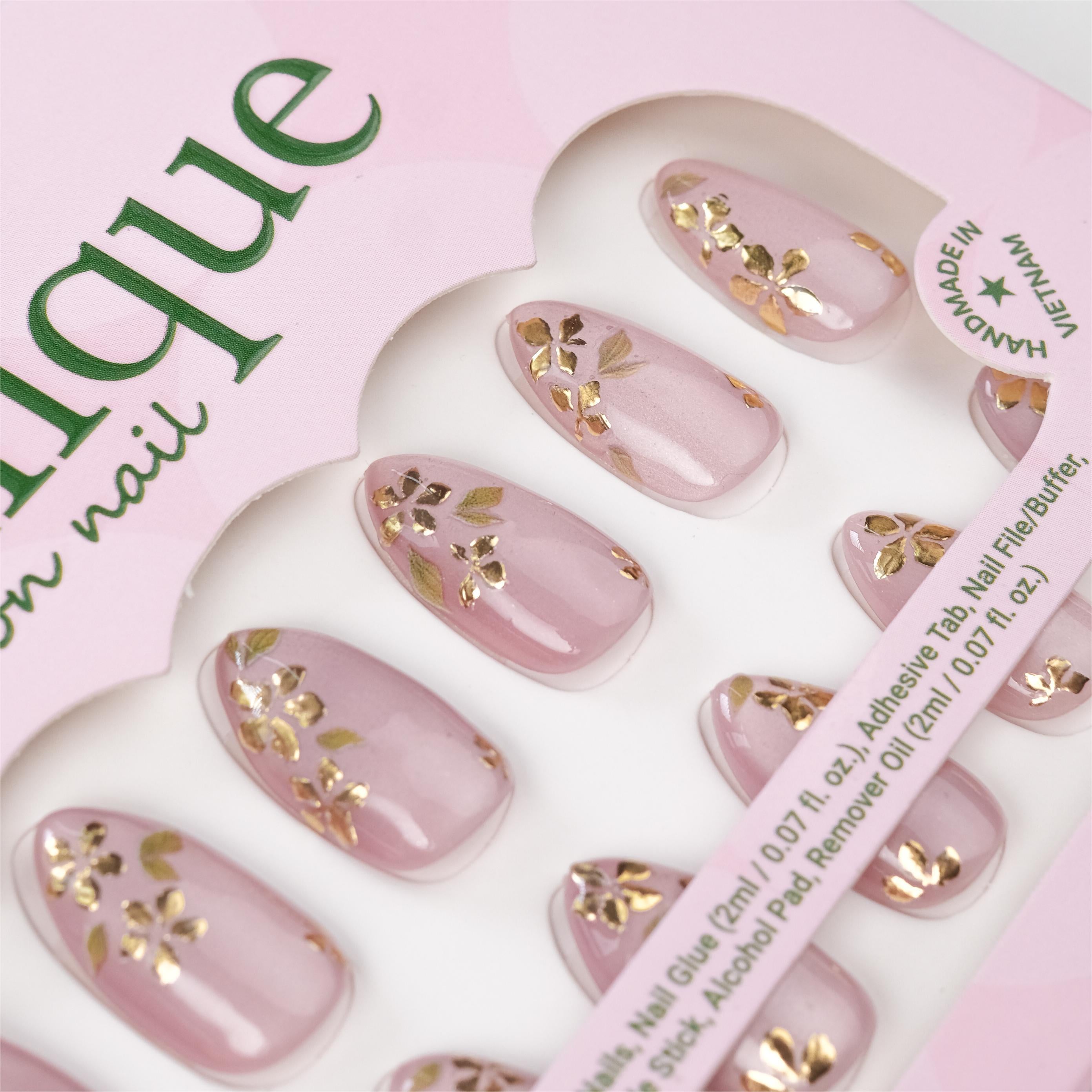 Handmade pink cat eye soft gel press-on nails with gold foil floral design, short almond shape, 26 reusable tips with glue and remover.