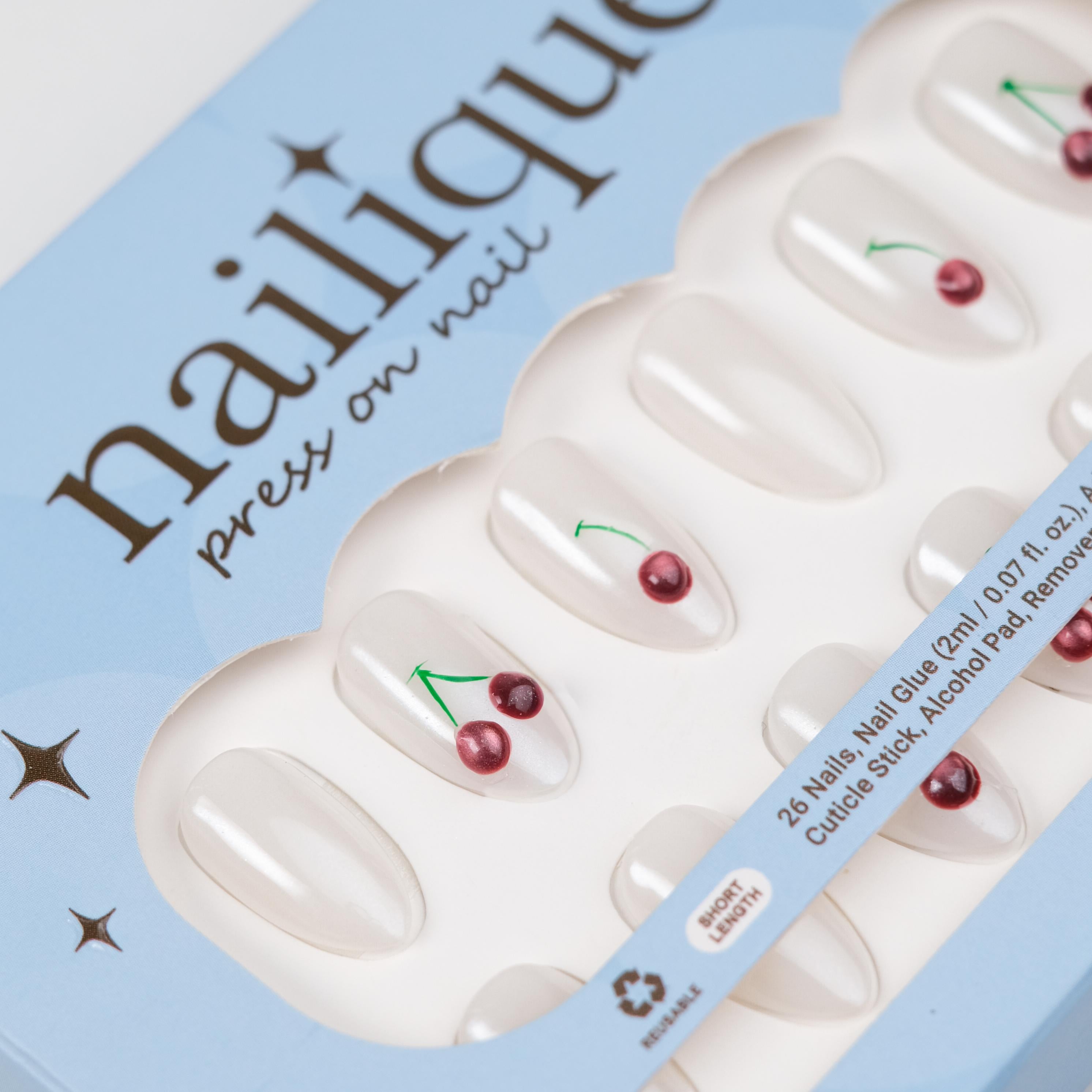 Nailique short almond press-on nails with hand-painted 3D cherry design, soft gel milky pearl finish, 26 reusable tips with glue and remover