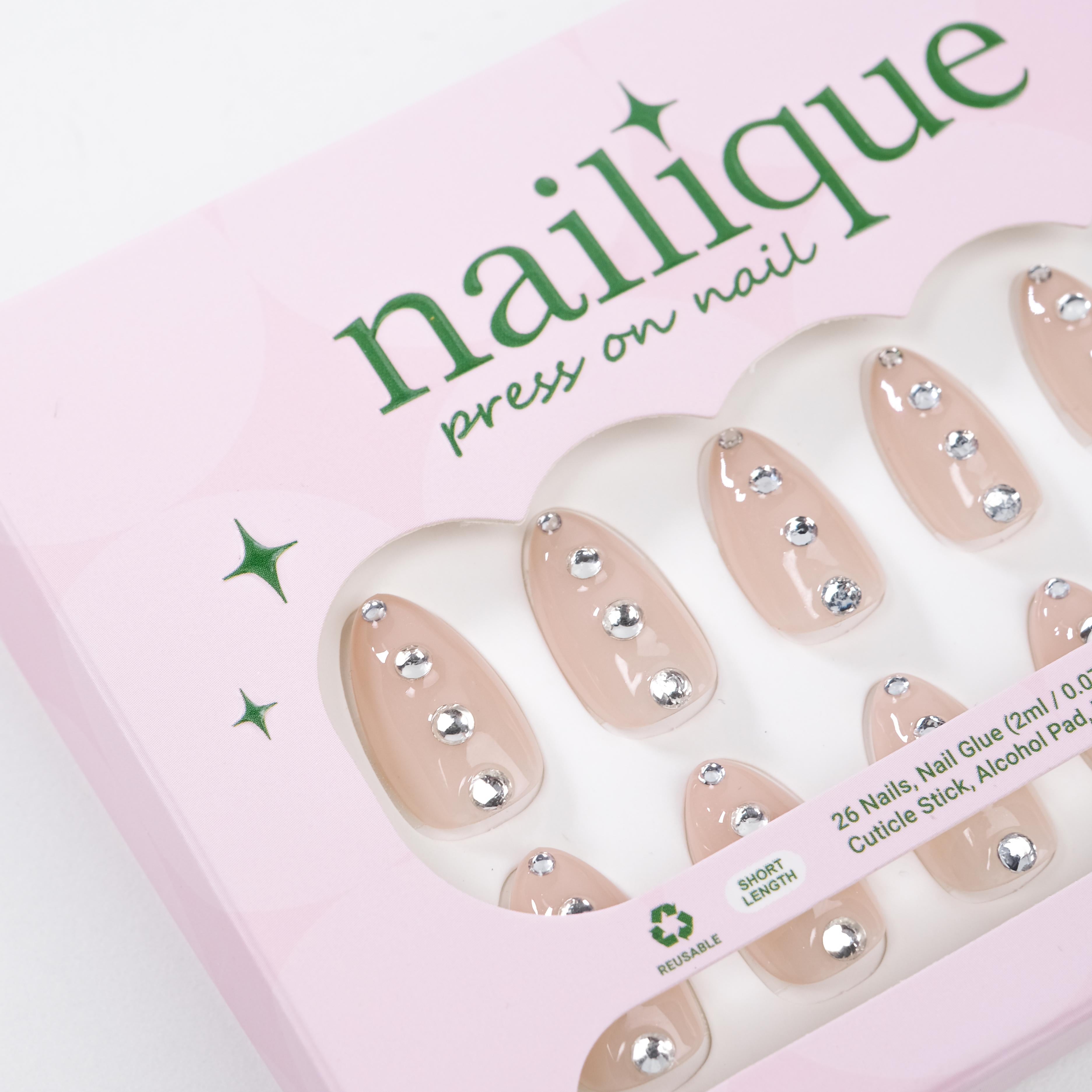 Nailique short almond press-on nails in nude with silver crystal rhinestones and minimal sparkle, reusable 26-piece gel manicure set