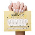 Handmade short almond press-on nails by Nailique featuring chrome glaze, white and black polka dots, soft gel finish.
