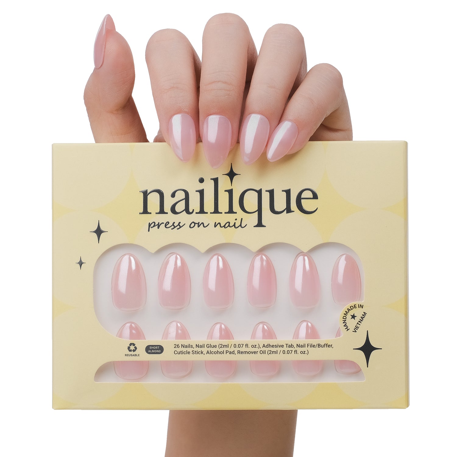 Handmade short almond press-on nails with chrome glazed donut design and ombre nude pink soft gel finish by Nailique.