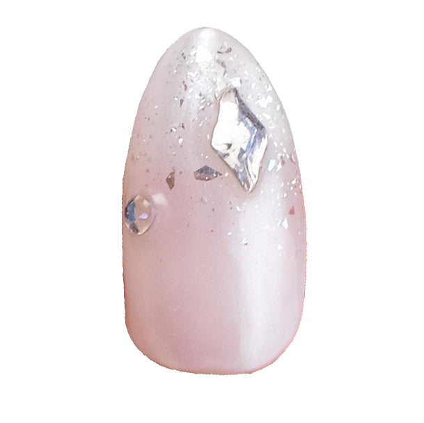 Handmade short almond press on nails by Nailique with soft gel, pearl chrome finish, rhinestones, and glitter for a bridal look.