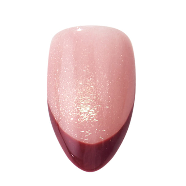 Short almond press on nails by Nailique with red French tips, cat eye design, yellow shimmer, handmade soft gel for a stylish look.